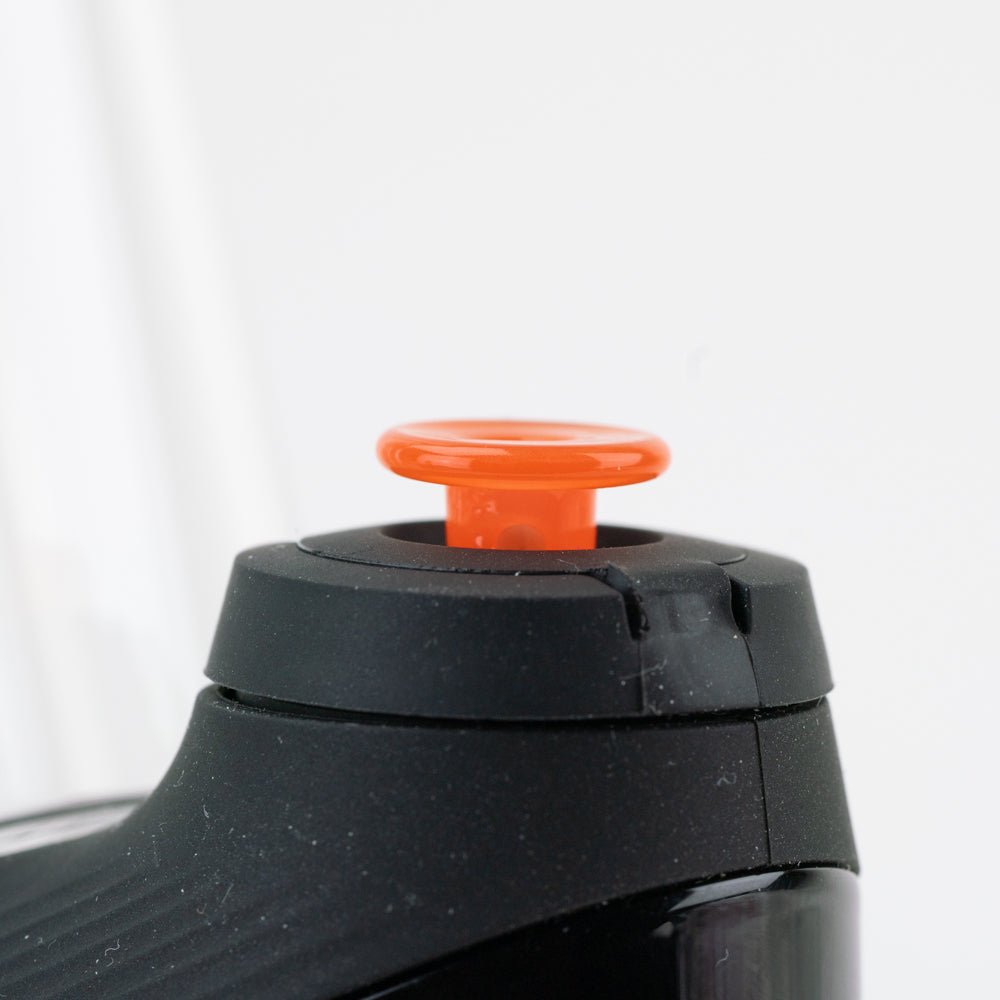 Orange glass joystick cap shown for Puffco New Peak setup