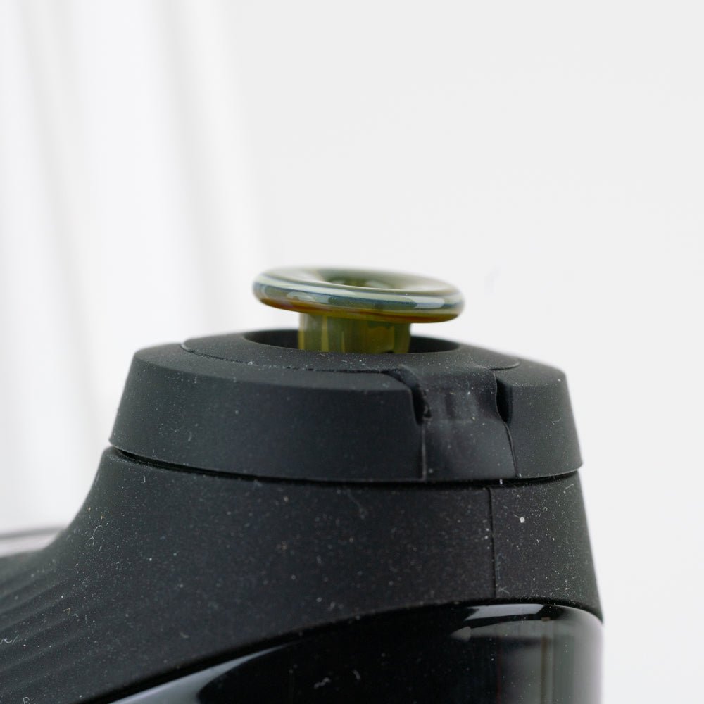 Glass joystick cap in Vintage green shown in Puffco New Peak