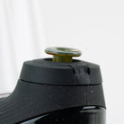 Glass joystick cap in Vintage green shown in Puffco New Peak