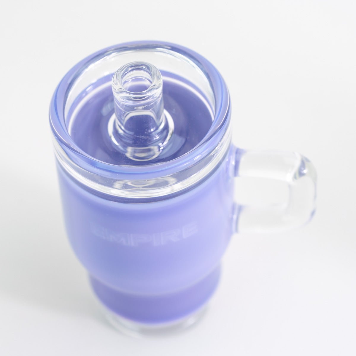 Purple tumbler glass attachment displayed on a Puffco Peak Pro device
