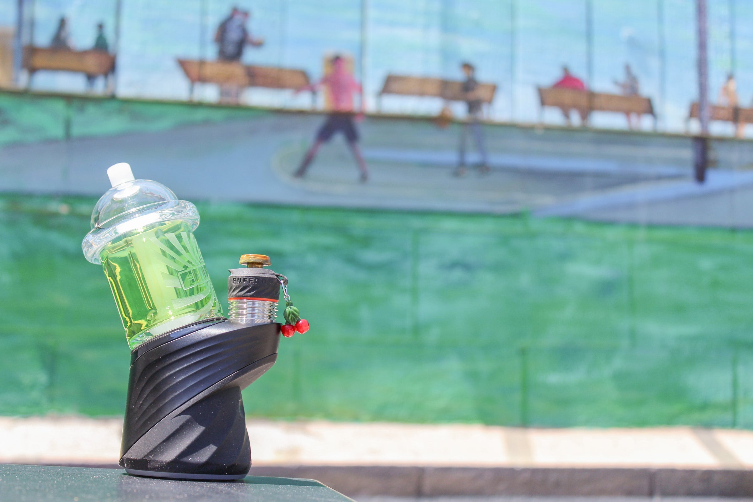 Puffco Peak Pro with custom glass attachment and Sunrise glass joystick cap in Laguna Beach