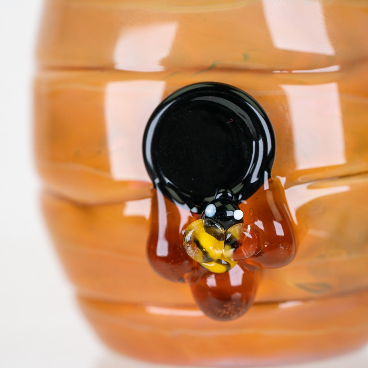 Close-up of the miniature bee detail on the Puffco Proxy Core attachment