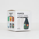A white cardboard product box for Puffco Proxy Core Attachment by Empire Glassworks, shown on a clean light gray studio background. The box features product imagery and text including 'Complete the Collection' and 'Under the Sea' with illustrated glass bottle designs.