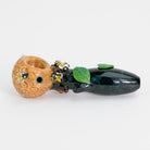 A glass pipe with honey bee and leaves