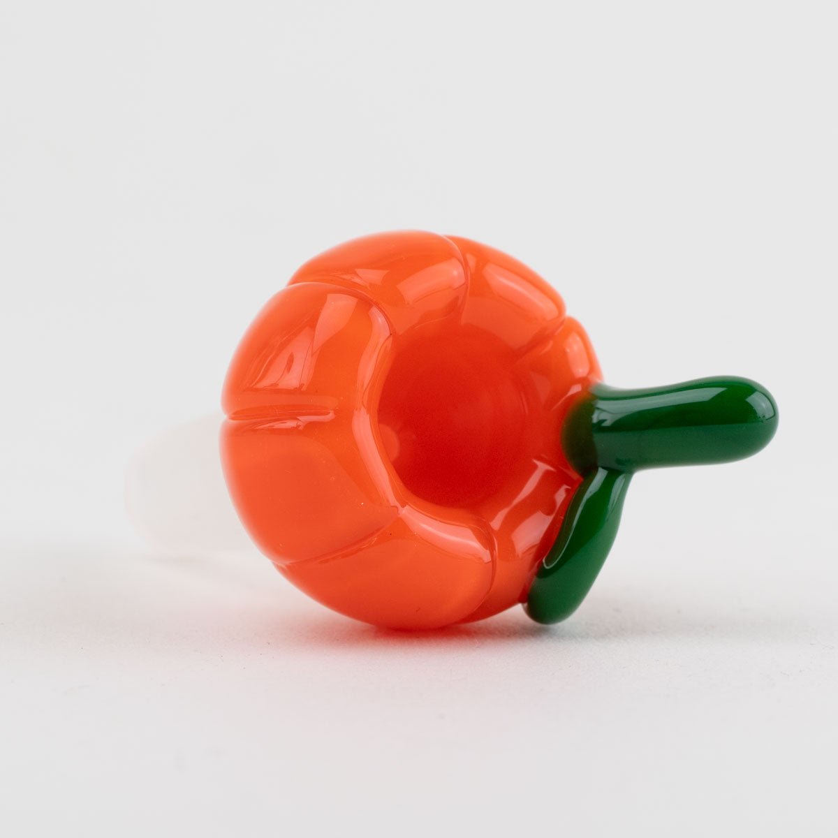 Orange pumpkin bowl piece with a green stem made of glass