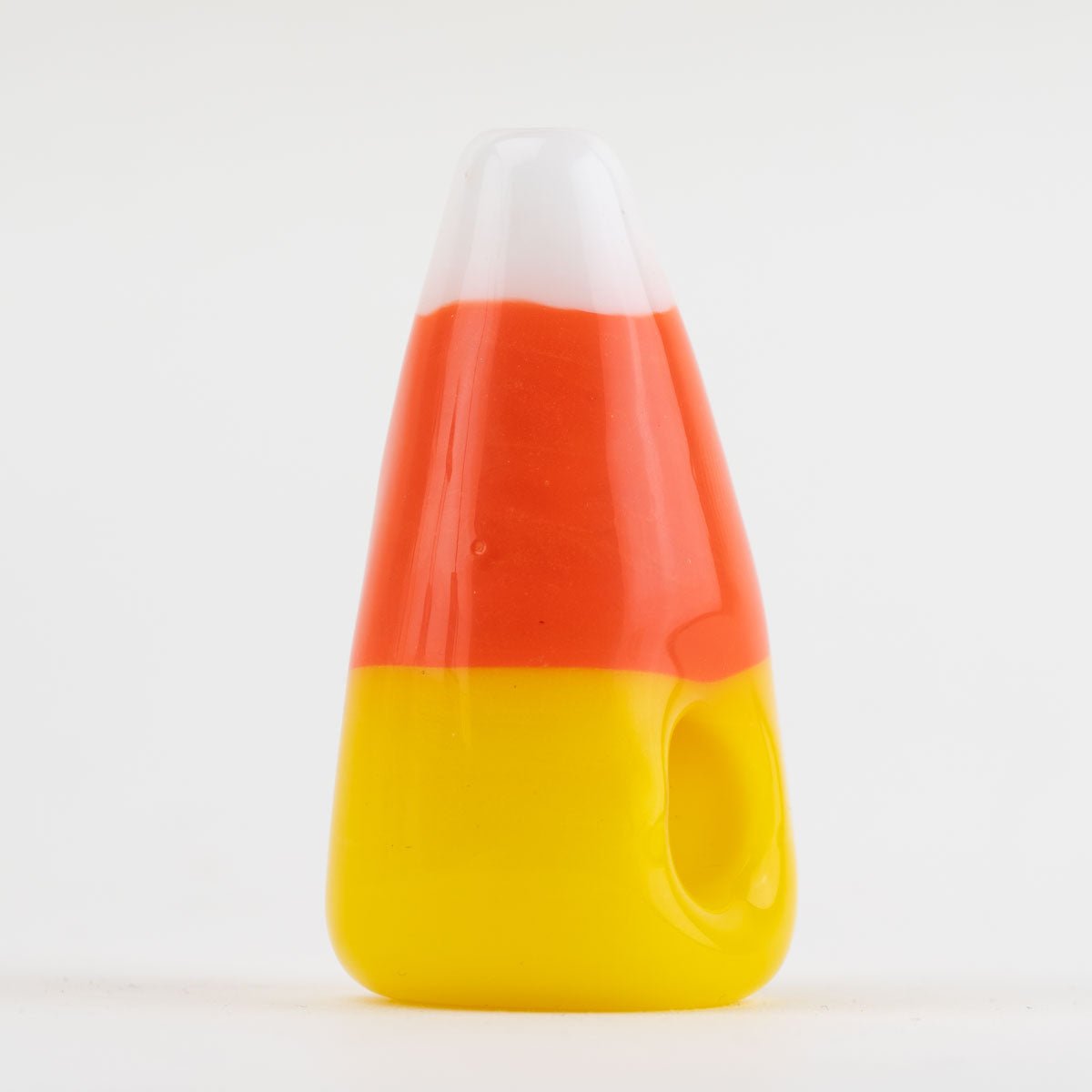 Candy corn-shaped dry pipe with orange, white and yellow stripes.