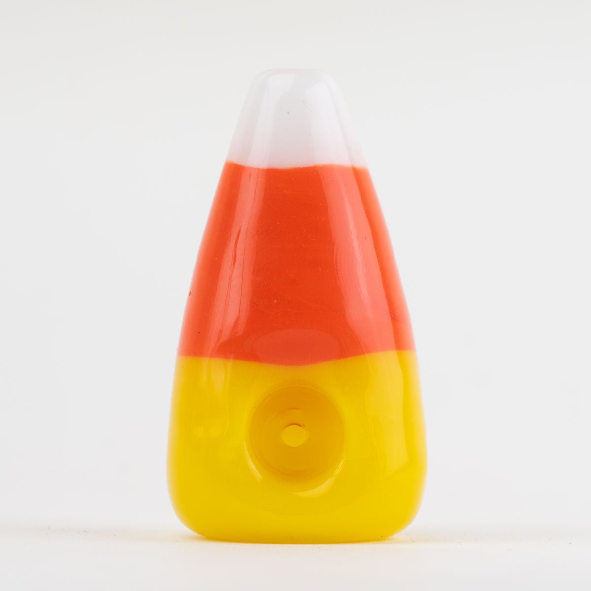 Candy corn-shaped dry pipe on a white background