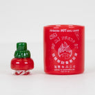 Front view of the red Sriracha Sauce Proxy Core Attachment with white label artwork