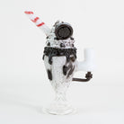 A sundae cookie glass mini rig with red striped straw