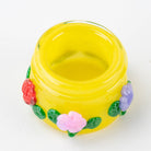 Sunshine Garden glass terp jar with colorful floral accents and a covered design