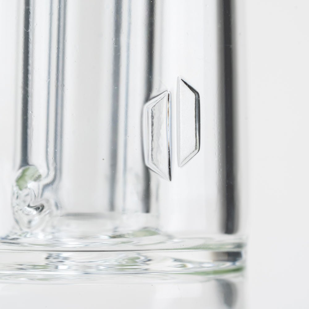 The logo on the Tall Empire Glassworks Puffco Peak attachment