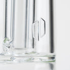 The logo on the Tall Empire Glassworks Puffco Peak attachment
