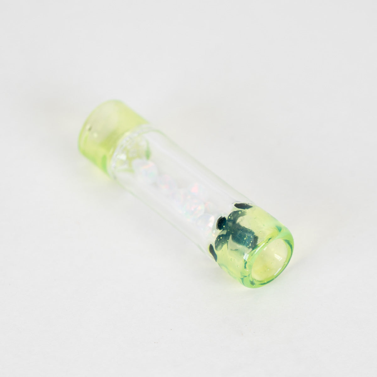 Green and clear glass rolling tip with iridescent opals inside