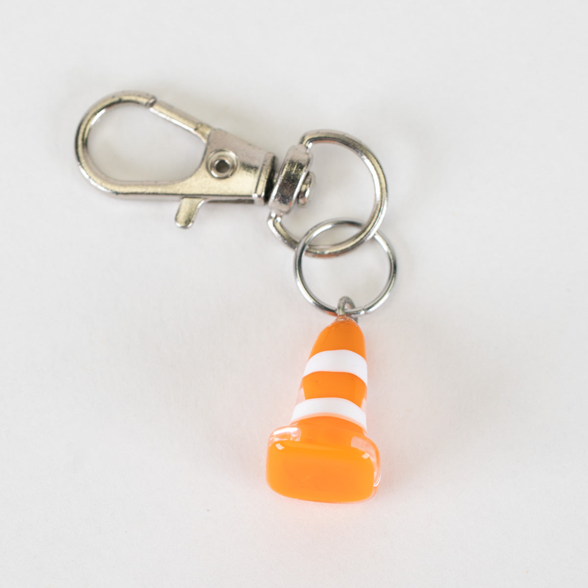 Traffic cone glass Puffco charm with orange and white stripe detail