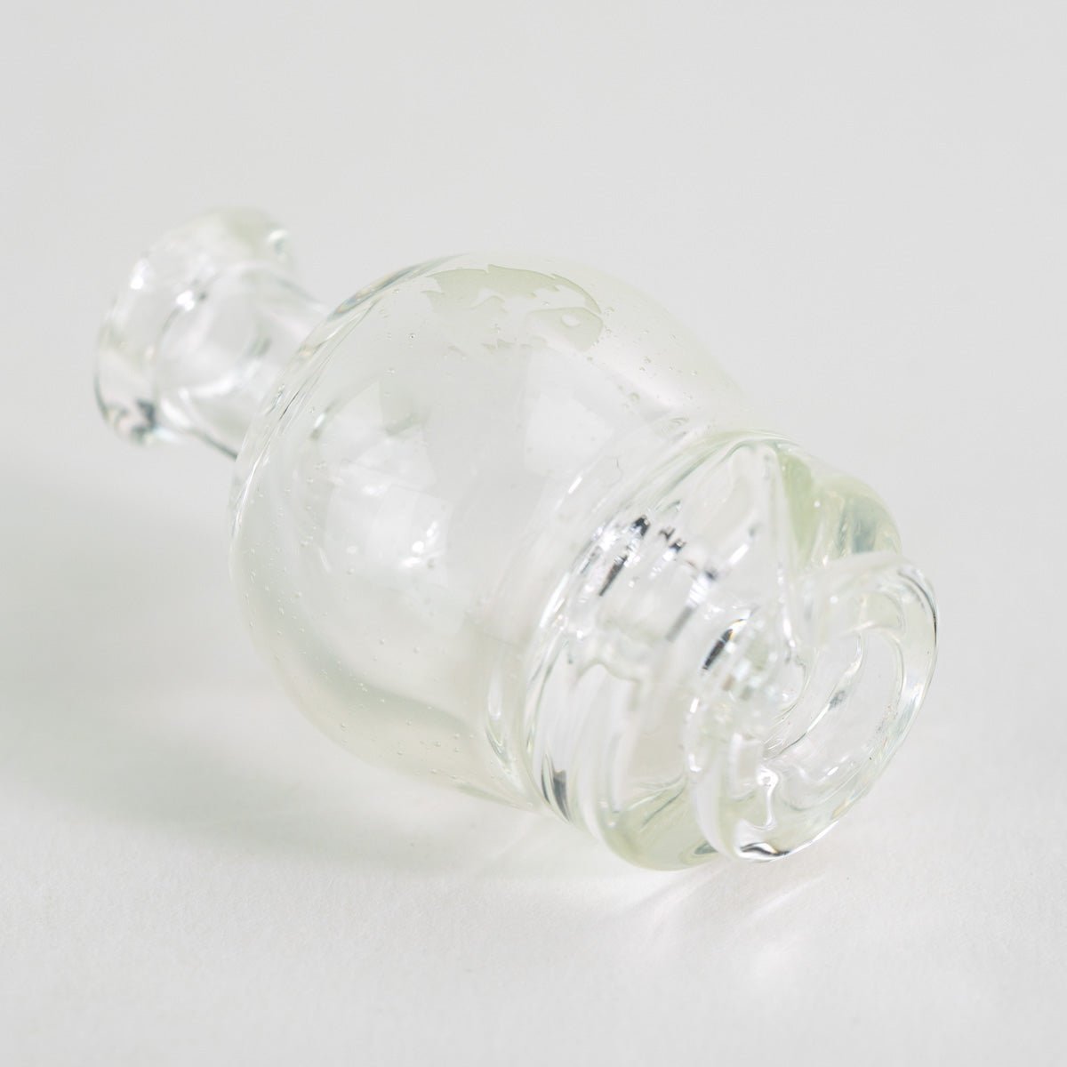 Close up of UV blue Empire Glassworks Pivot glass mouthpiece with glow effect