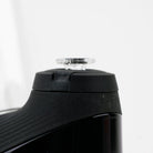 Clear glass Puffco cap that turns pink when exposed to UV light