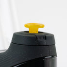 Close-up of a yellow Puffco joystick cap with bright glass color