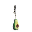 An avocado designed roach clip with metal teeth to hold joints.