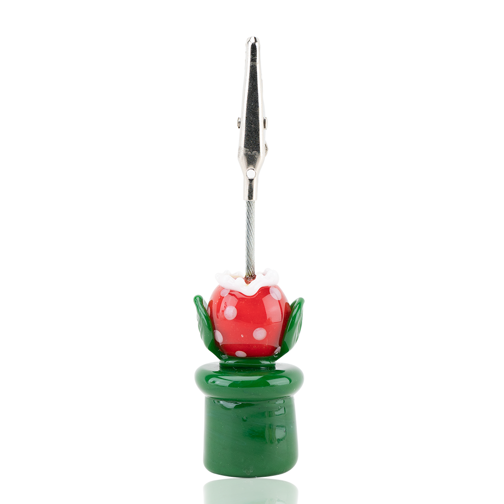 A roach clip with a Piranha Plant design used for holding joints.