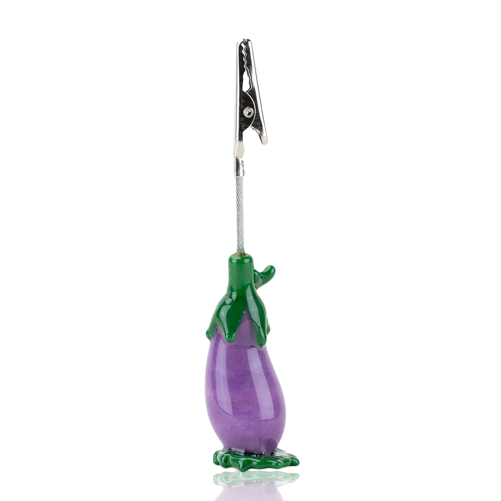An eggplant shaped roach clip used to hold joints and other smokeables. 