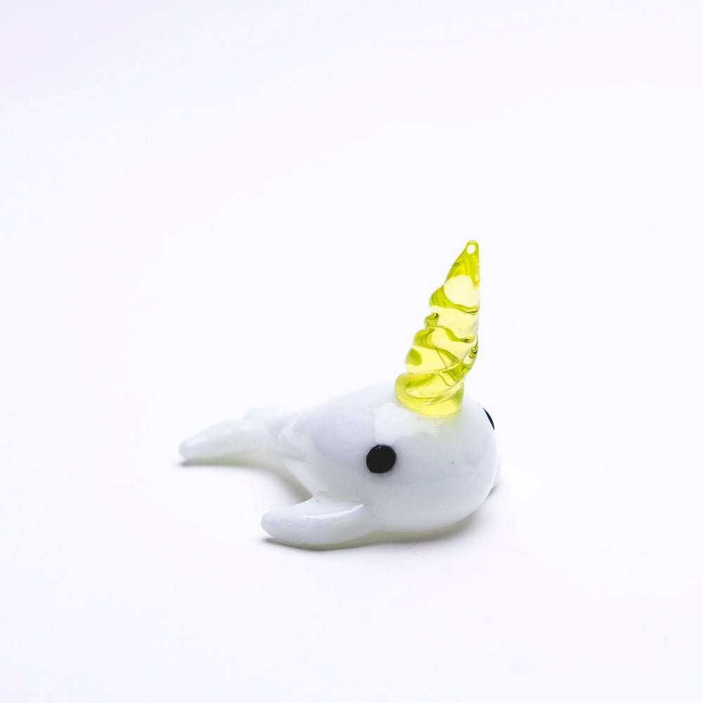 Empire Glassworks Radioactive Narwhal Dabber with white glass body and yellow horn