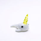 Empire Glassworks Radioactive Narwhal Dabber with white glass body and yellow horn
