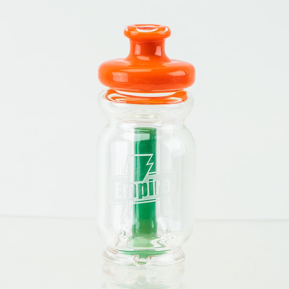 Iconic squeeze bottle Puffco Peak attachment by Empire Glassworks with orange and green accents